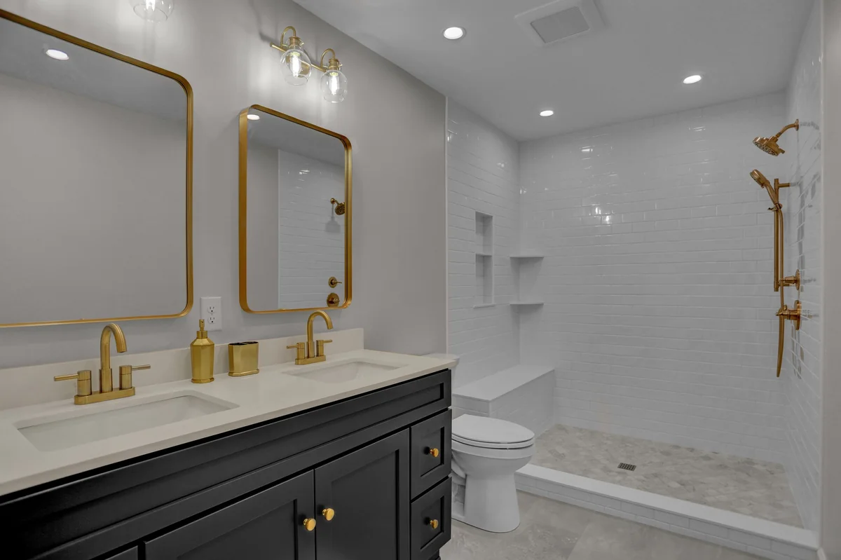 Bathroom remodel with walk-in shower and double vanity by JB Plumbing HVAC